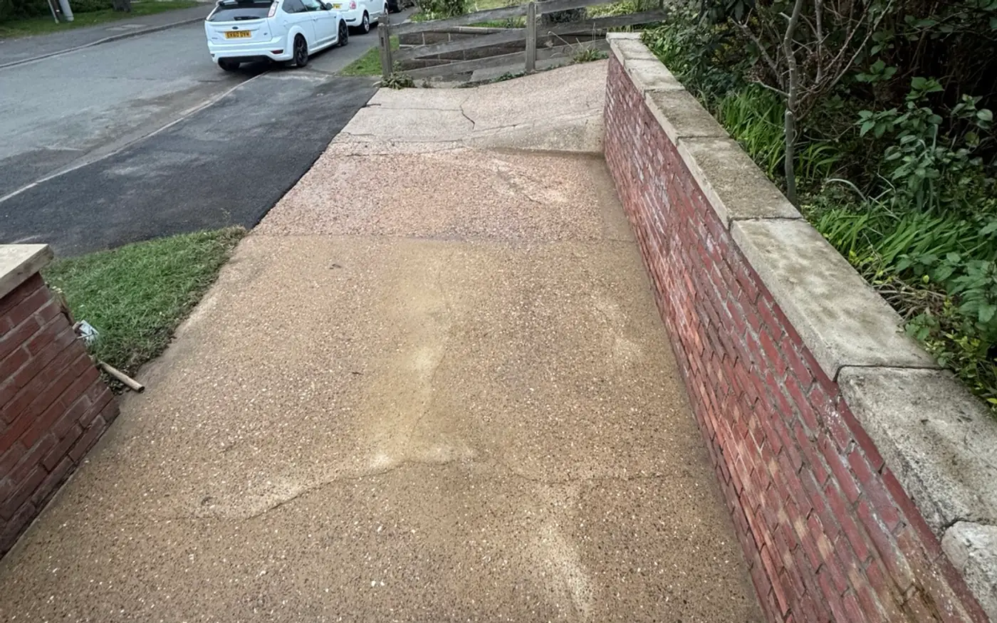 The same front path and brickwork cleaned to an even pale finish